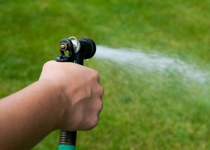  How much water flows through a garden hose per hour