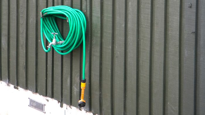  How high should a hose hanger be?